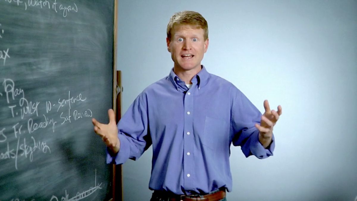 Dwane Thomas teaching by a blackboard